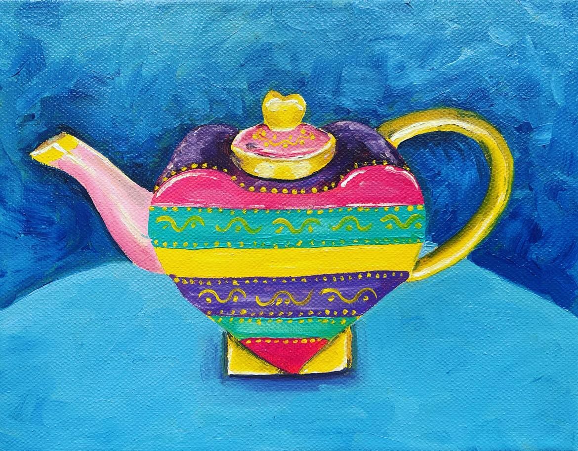 Yellow teapot on blue background