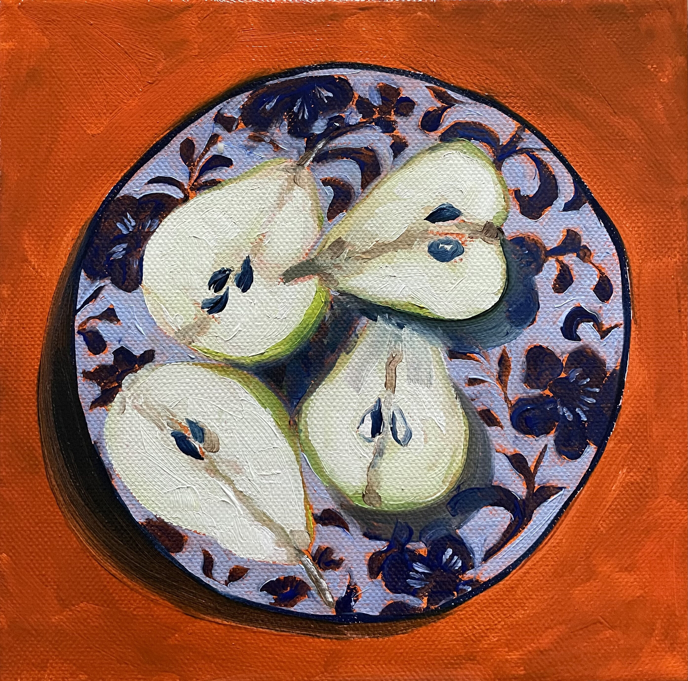 Cut pears on blue plate